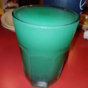 a green drink in a glass