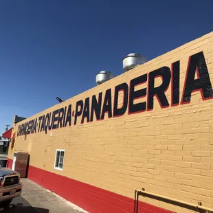 a truck parked in front of a building