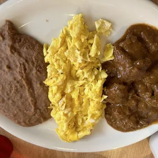 Lupito special:  carne guisada, eggs, and refried beans
