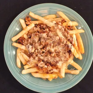 a plate of pasta with meat and cheese