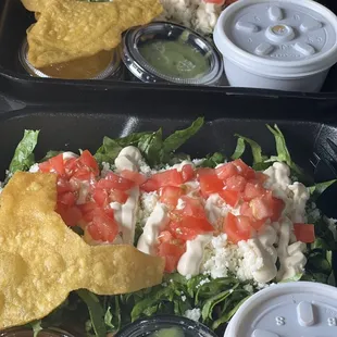 two trays of mexican food