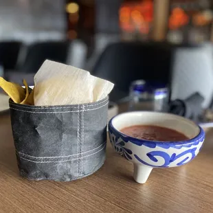 Cute little bag of chips and 2 types of salsa for the table
