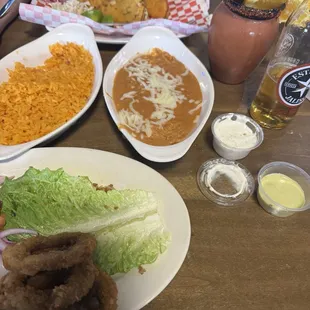 Fried calamari, beans, rice, quesabirria tacos, paloma