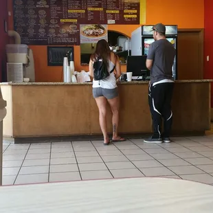 a man and a woman at a counter