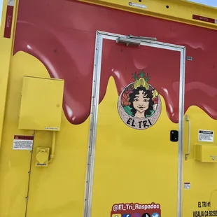 a yellow and red food truck
