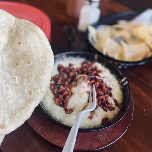 a person holding a tortilla