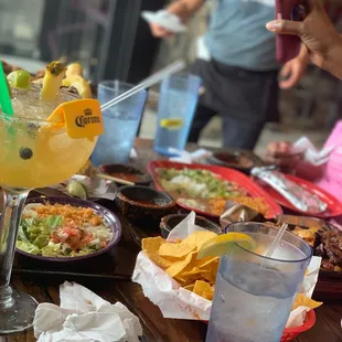 a table full of food and drinks