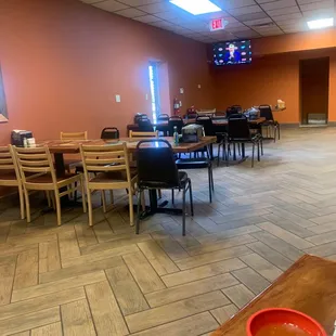 a dining room with tables and chairs