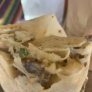 a close up of a burrito