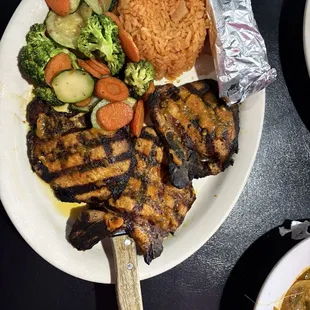 Chuletas (thin grilled and seasoned pork chops)