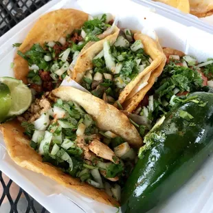 4 tacos - chicken (dry), pastor (flavorful), asada (chewy and bland), chorizo (sliced sausage)