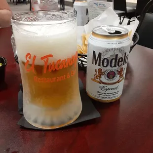 a glass of beer and a can