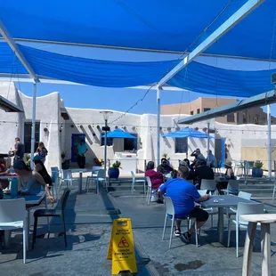 a group of people sitting at tables