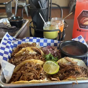Birria tacos with hot sauces