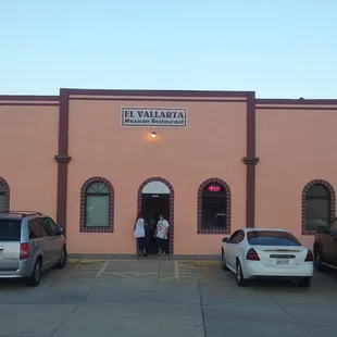 cars parked in front of a building