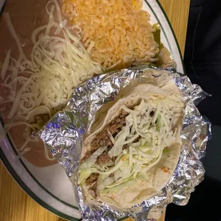 Kid's taco, with rice and beans.