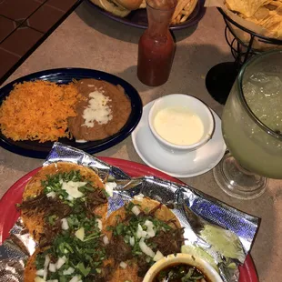 The birria tacos and queso blanco are delicious!