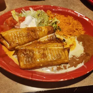 Fried one chicken and one beef chimichangs
