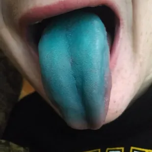 a child with a blue tongue