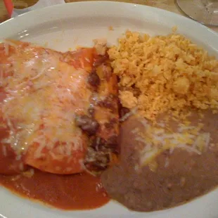 a plate of enchiladas and rice