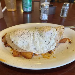 Potato and chorizo, bean, cheese, with 2 fried eggs over medium.