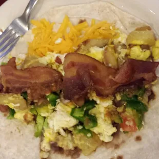 Breakfast taco with salsa is good and spicy but flavorful.