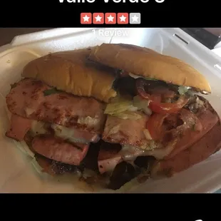 a sandwich with meat and vegetables