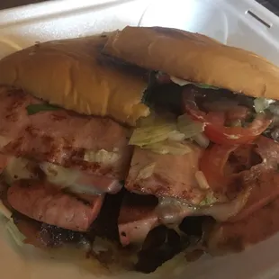 a sandwich in a styrofoam container