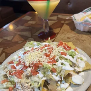 The nachos were awesome and the Margarita was amazing!