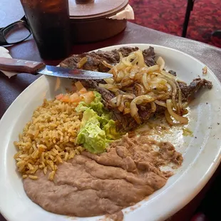 The rice looks old and dry but had a good taste. The steak was tender and tasty.