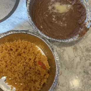 Groove beans with a half melted cheese and wrong rice.