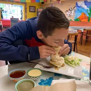 Chicken burrito with the sauces on the side for my son!