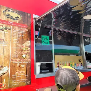 a man ordering food from a food truck
