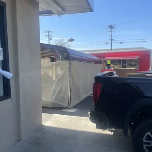 a truck parked in front of a building