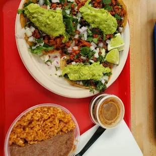 Adobada Tacos with Guacamole and a side of Rice and Beans