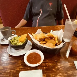 a man sitting at a table with food