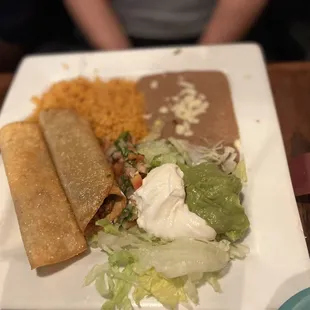 Taquito, rice refried beans
