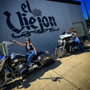 a woman sitting on a motorcycle