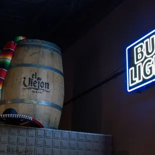 a barrel and neon sign