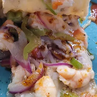 A peek inside a slice of their yummy shrimp quesadillas