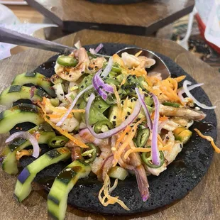 Molcajete  Shrimp cooked in lime* juice, octopus, scallops, cucumber, serrano peppers in a shrimp juice.