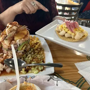 Tropical seafood tower and callo de hacha tostada. Really good!