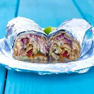The burrito goes with: refried beans, red rice, cabbage, tomato, onion, cilantro and the protein of your choice.