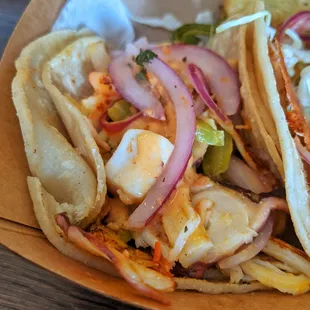 So good. The Botana taco has, Spicy shrimp octopus imitation abulone, imitation crab meat grilled with bell peppers and onions.