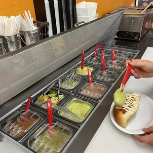 Side bar of toppings salsa verde and roja