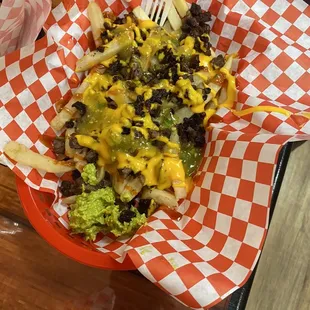 Carne Asada Fríes. Fresh made French fríes toped  with Carne asada, and you can add your own condiments.