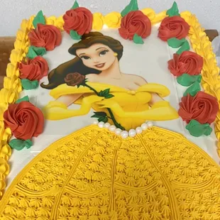 a cake with a picture of a princess on it