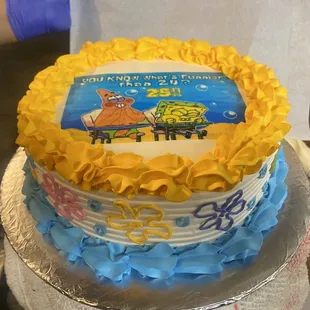 a birthday cake with spongeach on it