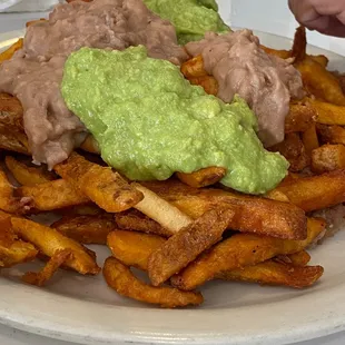 Carne Asada Fries made with beans and gauc