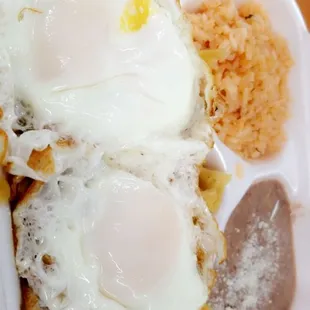 two fried eggs in a styrofoam container